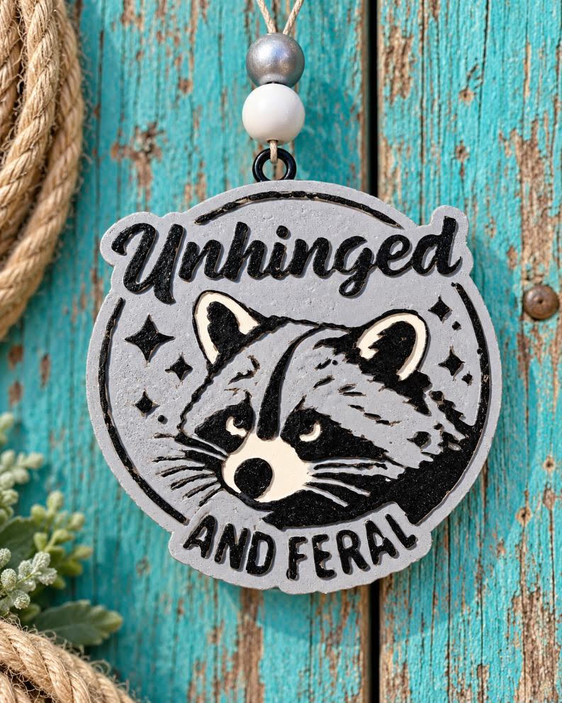 Unhinged and Feral raccoon car freshie in silver