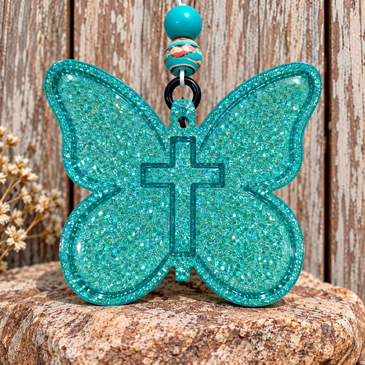 Teal glitter butterfly with cross car freshie