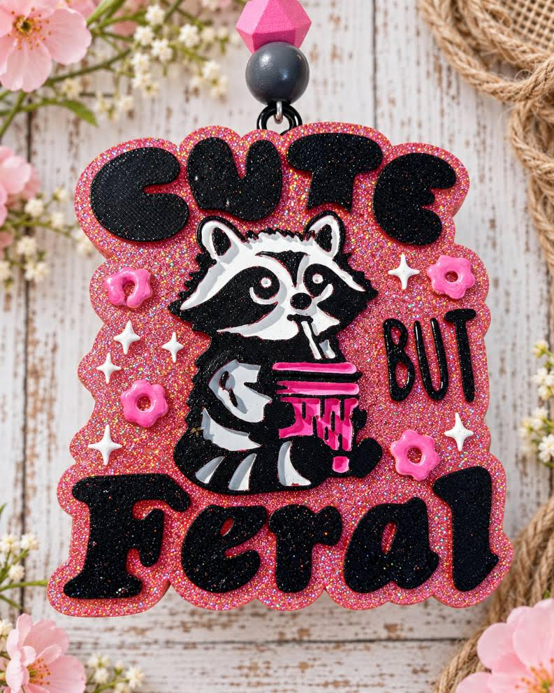 Cute But Feral raccoon car freshie in hot pink glitter